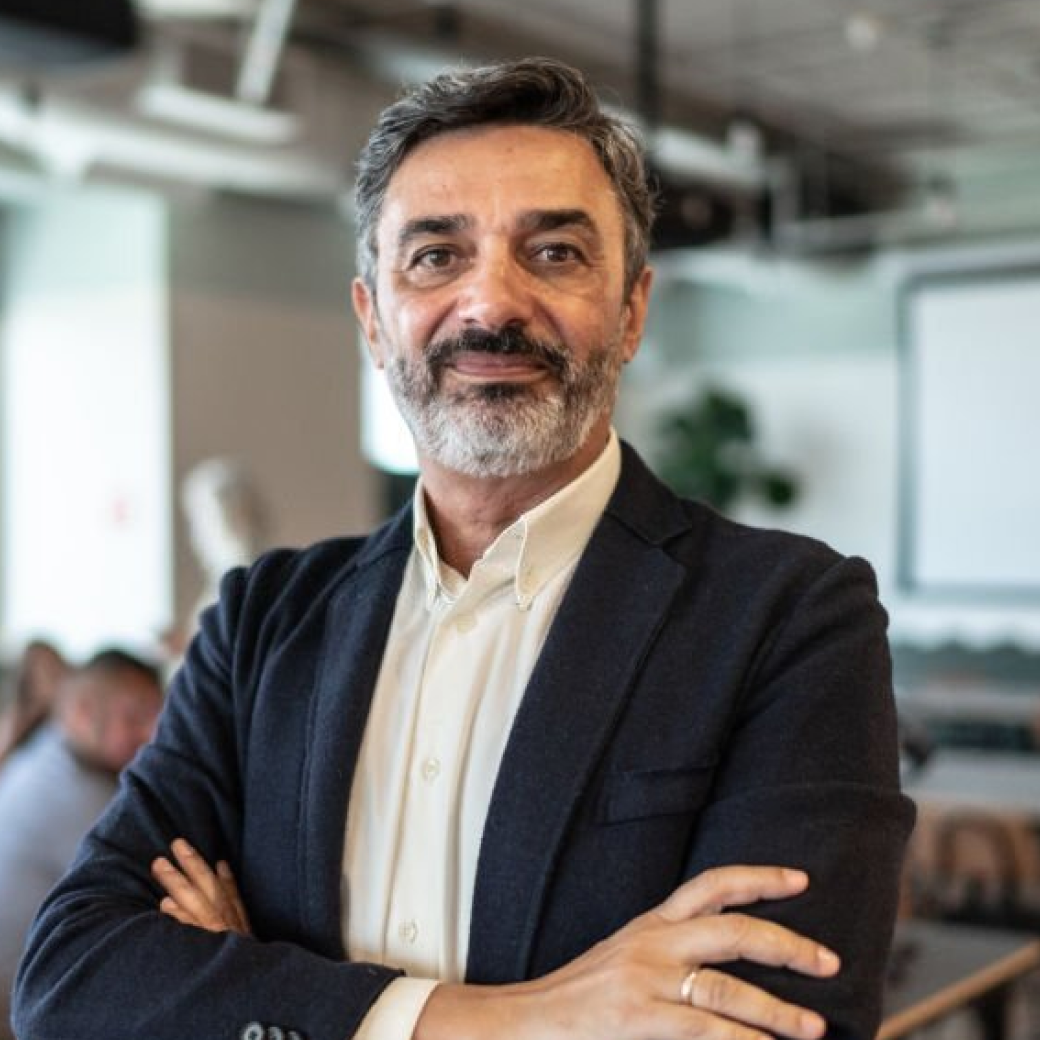 A businessman standing with his arms crossed